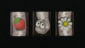 Spieletipp: "Da ist der Wurm drin" von Zoch, Wurm mit Erdbeere und Gänseblümchen